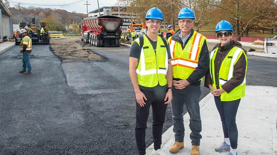 RMF Paving team members in safety gear on an asphalt job site